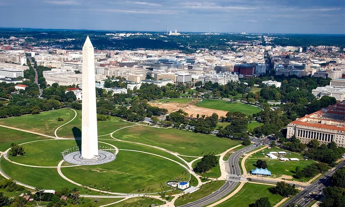 Aerial view of the Washington Monument and National Mall with the city skyline.